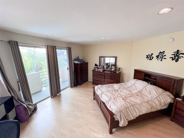 bedroom with access to outside, light wood finished floors, and recessed lighting