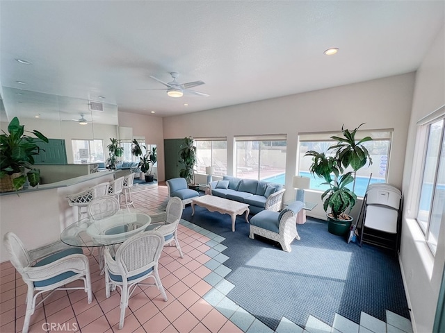 sunroom with visible vents and a ceiling fan