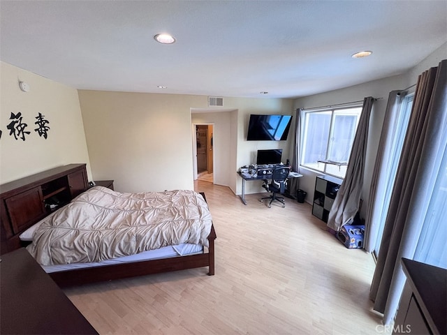 bedroom featuring light wood-style floors, recessed lighting, and visible vents