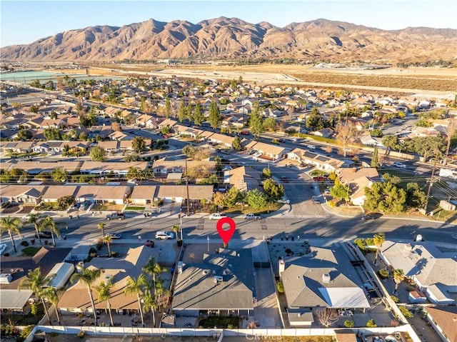 birds eye view of property with a residential view and a mountain view