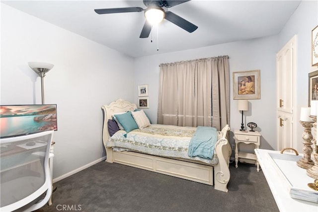 bedroom featuring ceiling fan, dark colored carpet, and baseboards