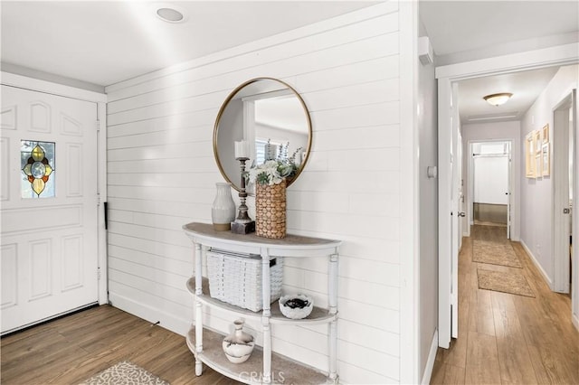 entrance foyer with light wood-style flooring and baseboards