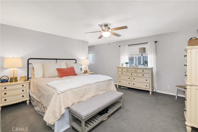 bedroom featuring ceiling fan, baseboards, and dark colored carpet