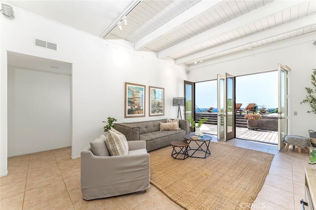 living room featuring light tile patterned floors, wood ceiling, visible vents, beamed ceiling, and track lighting