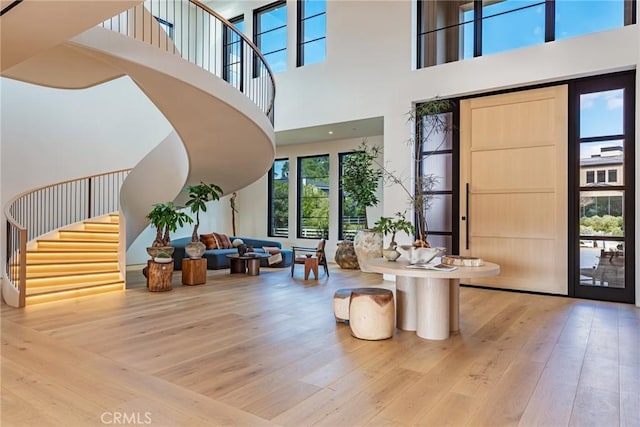 entrance foyer featuring wood-type flooring and stairs