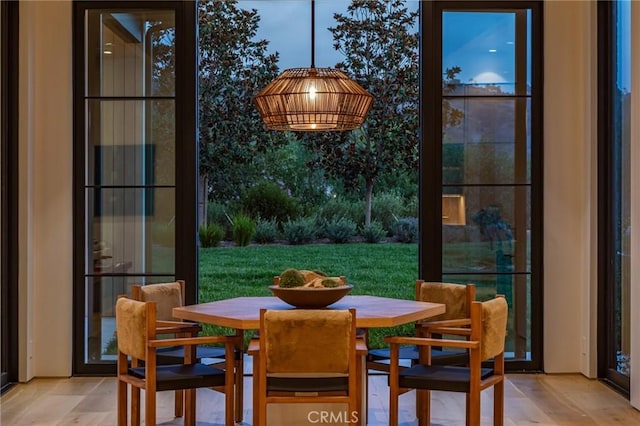 dining space with wood finished floors