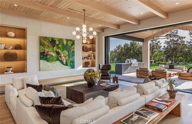 living room with wooden ceiling, built in shelves, a chandelier, and beam ceiling