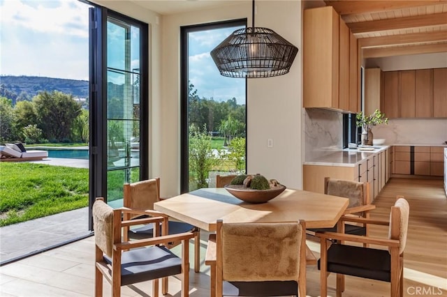 dining area with light wood-type flooring