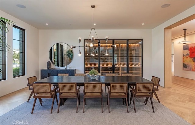 dining space featuring recessed lighting and an inviting chandelier