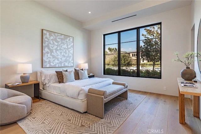 bedroom with recessed lighting and light wood finished floors