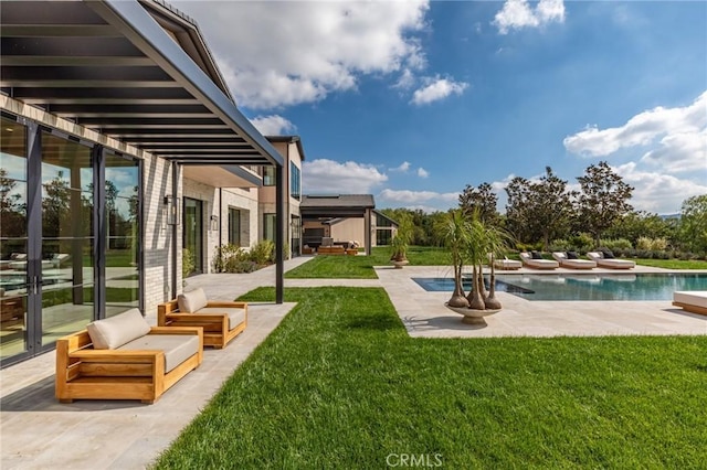 view of yard featuring a patio and an outdoor pool