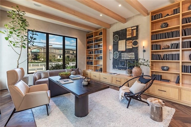 sitting room with built in shelves, recessed lighting, and beamed ceiling