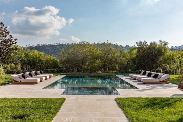 outdoor pool with a patio