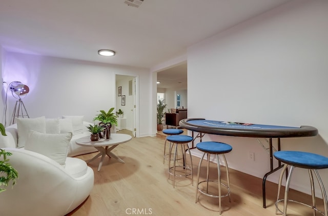 interior space featuring light wood-type flooring and visible vents