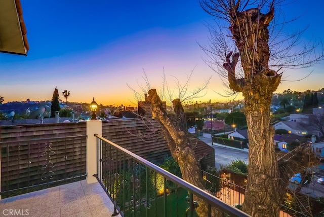 view of balcony at dusk