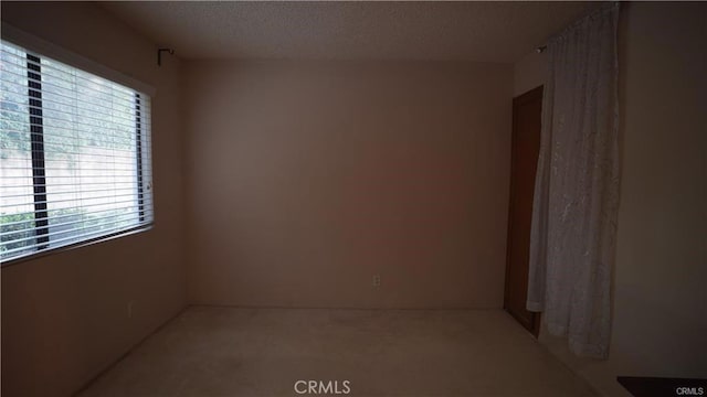 empty room with a textured ceiling