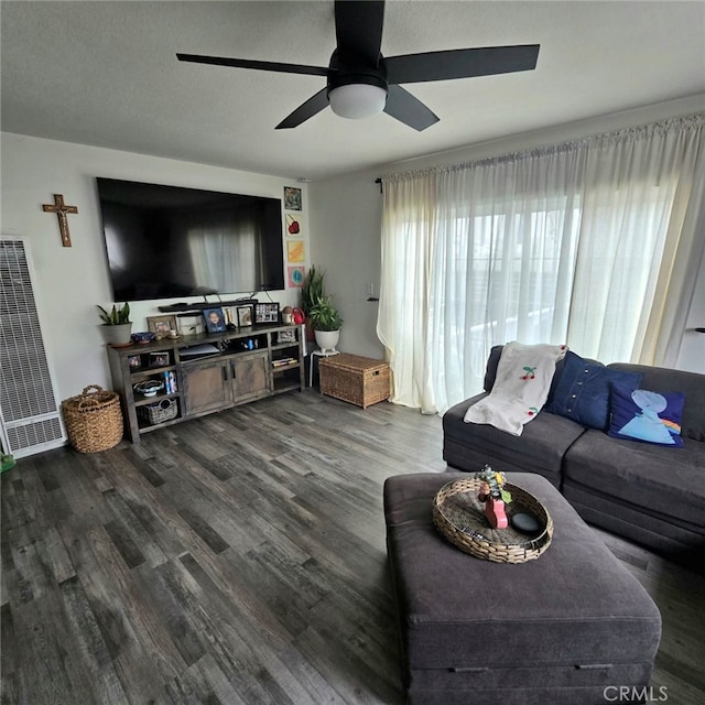 living room featuring a ceiling fan and wood finished floors