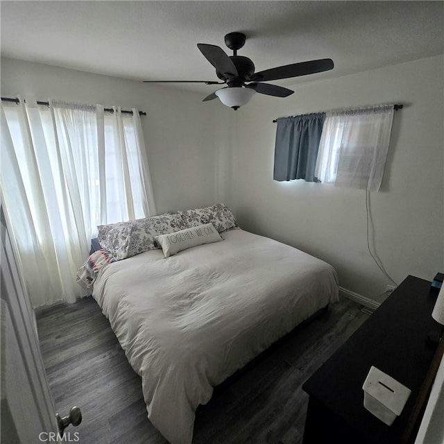 bedroom featuring ceiling fan and wood finished floors