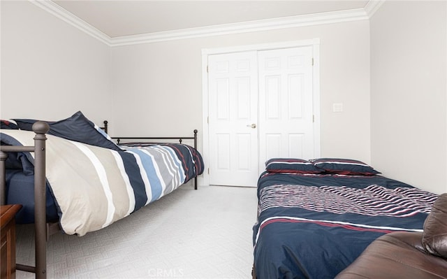 carpeted bedroom featuring a closet and crown molding