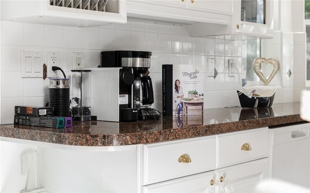 3105 E Beach Cir, Bradley, CA 93426 - kitchen with glass insert cabinets, backsplash, and white cabinetry