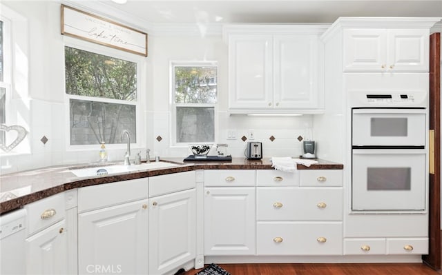 3105 E Beach Cir, Bradley, CA 93426 - kitchen with dark stone countertops, white appliances, white cabinets, backsplash, and a sink