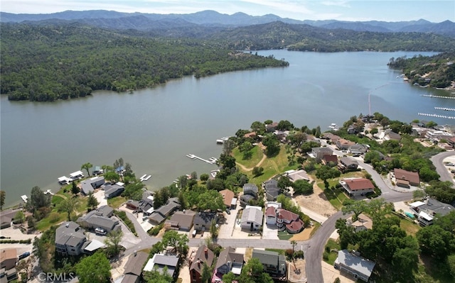 bird's eye view with a residential view and a water and mountain view