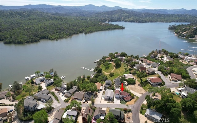 birds eye view of property with a residential view and a water and mountain view