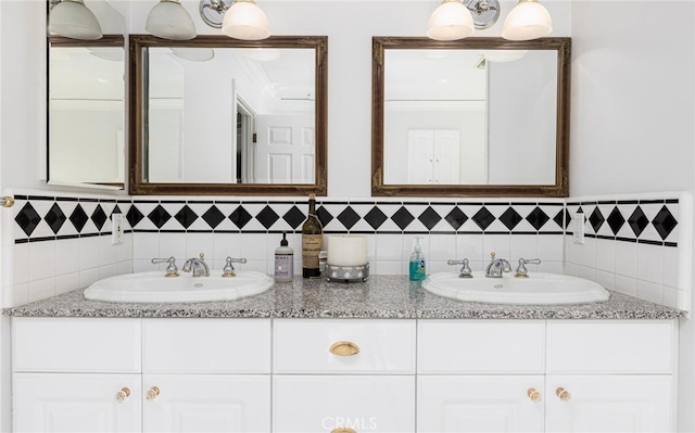 bathroom with double vanity and a sink