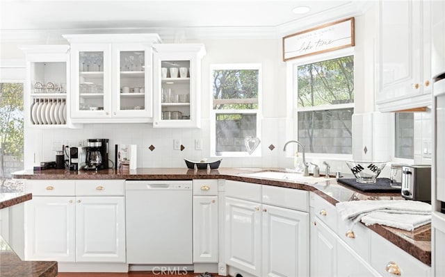 kitchen with crown molding, white cabinets, dishwasher, and a sink