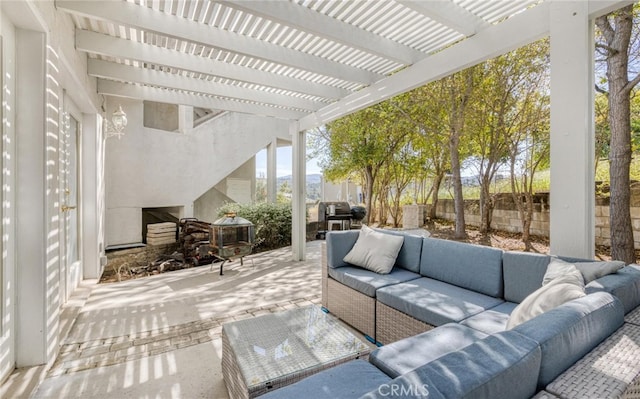 view of patio / terrace featuring fence, outdoor lounge area, and a pergola