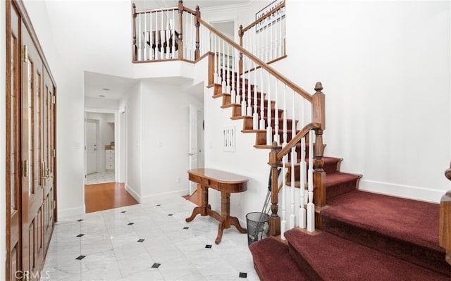 3105 E Beach Cir, Bradley, CA 93426 - staircase with a towering ceiling and baseboards