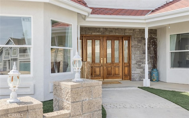 3105 E Beach Cir, Bradley, CA 93426 - doorway to property with stucco siding, a tiled roof, and stone siding