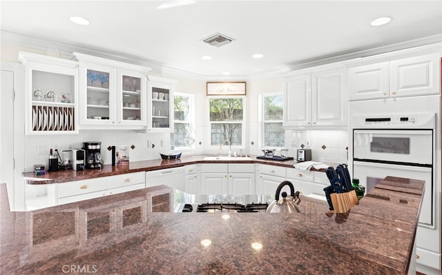 3105 E Beach Cir, Bradley, CA 93426 - kitchen with dark stone countertops, white appliances, a sink, white cabinetry, and visible vents