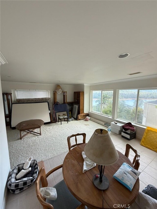 3105 E Beach Cir, Bradley, CA 93426 - dining area with crown molding, visible vents, carpet flooring, and tile patterned floors