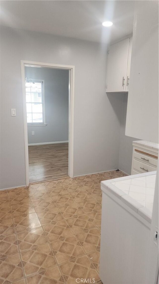 washroom featuring baseboards