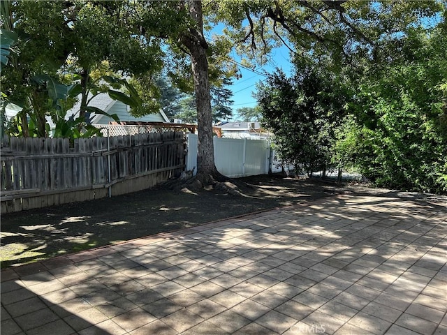 view of patio featuring fence