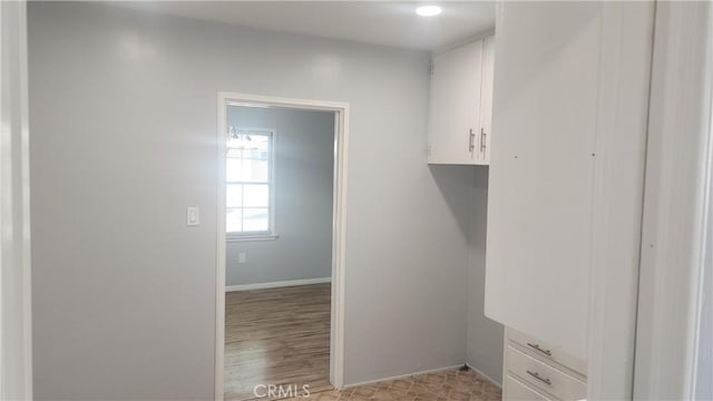 interior space with light wood-type flooring and baseboards