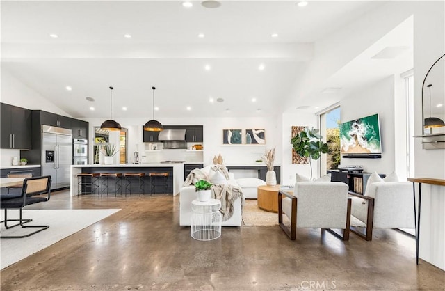 living room with finished concrete floors, recessed lighting, a fireplace, and lofted ceiling with beams