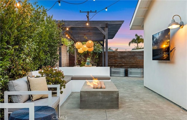 view of patio / terrace featuring fence, a pergola, and an outdoor living space with a fire pit