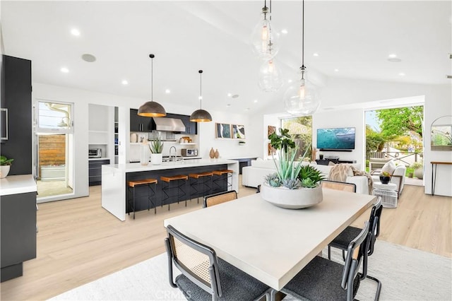 223 Robinhood Pl, Costa Mesa, CA 92627 - dining space with light wood-style floors, lofted ceiling, plenty of natural light, and recessed lighting