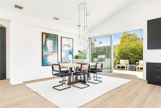 223 Robinhood Pl, Costa Mesa, CA 92627 - dining room featuring visible vents, light wood-type flooring, and high vaulted ceiling