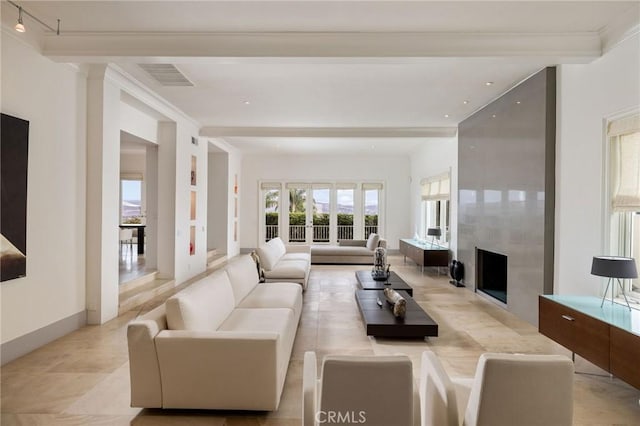 living room featuring crown molding, a fireplace, visible vents, and beam ceiling