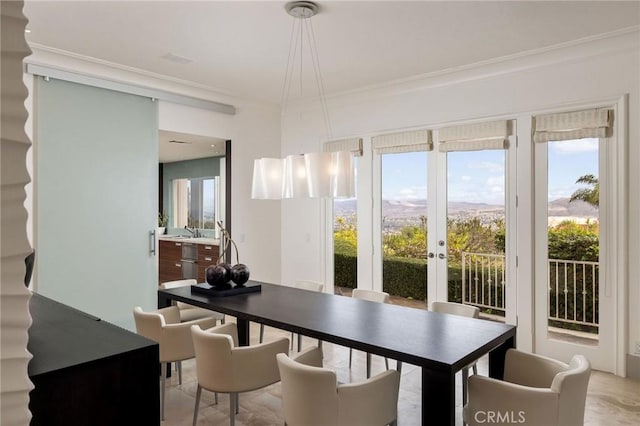 dining space with ornamental molding