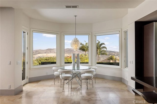 dining area with baseboards and visible vents