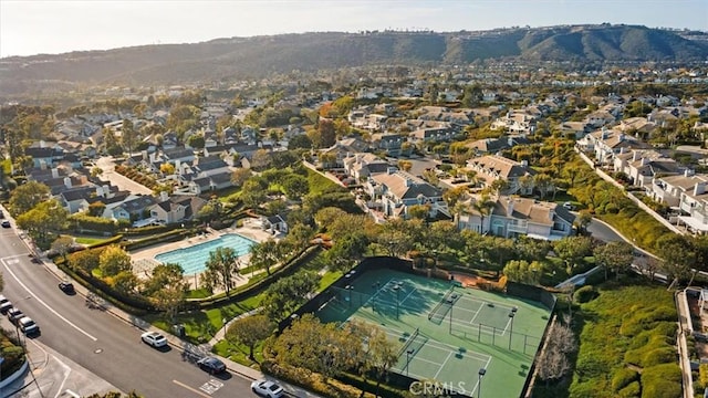 drone / aerial view featuring a residential view and a mountain view