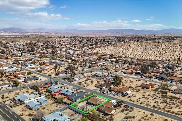 birds eye view of property featuring a residential view, a desert view, and a mountain view