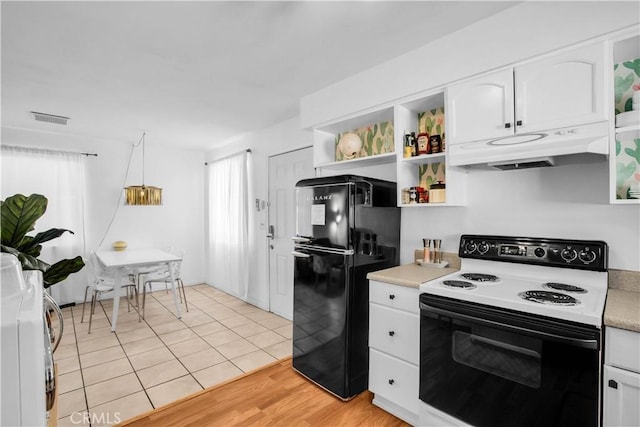 kitchen featuring white cabinets, electric stove, freestanding refrigerator, light countertops, and under cabinet range hood