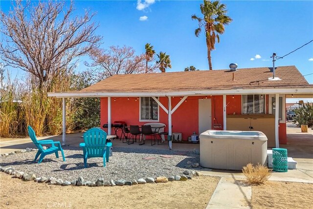 back of property featuring a patio