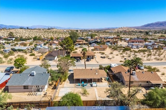 bird's eye view with a residential view, a desert view, and a mountain view