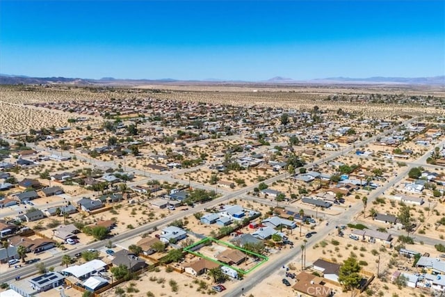 bird's eye view featuring a mountain view and a desert view